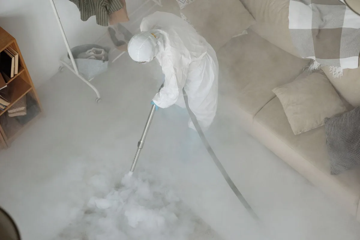 Biohazard cleanup technician in protective equipment, Seaside Heights, NJ